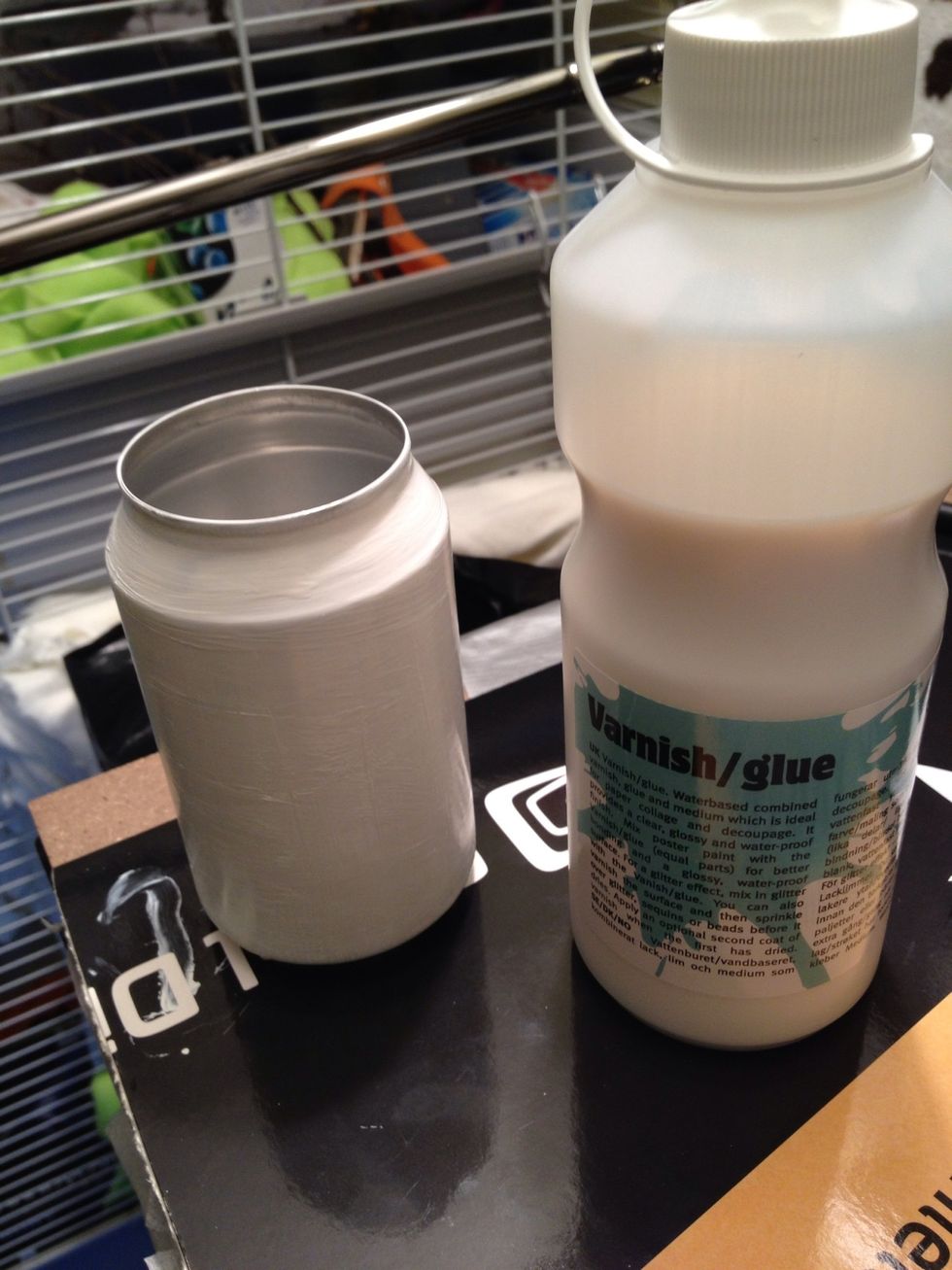 Use decoupage glue all over the painted can (make shure the paint i dry)
