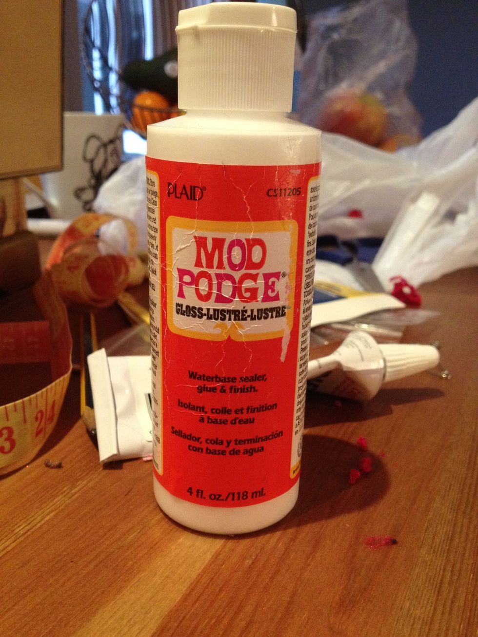 Use decoupage medium to stick the paper to the box..