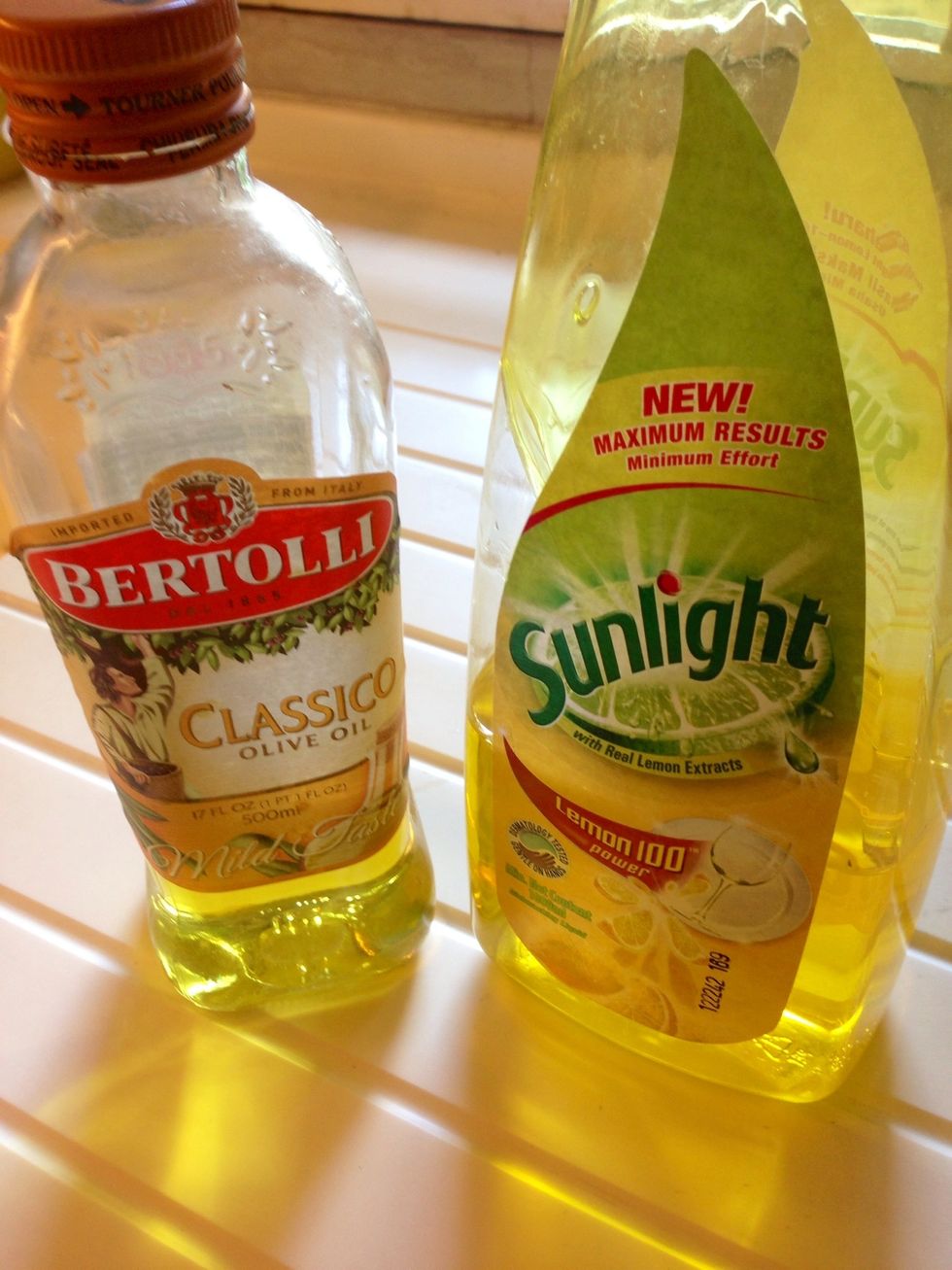 Use dish washing detergent mix with olive oil in equal quantity (I used 1tsp each for one load). The detergent will clean the residual from brushes while olive oil helps shoot and avoid the frizz