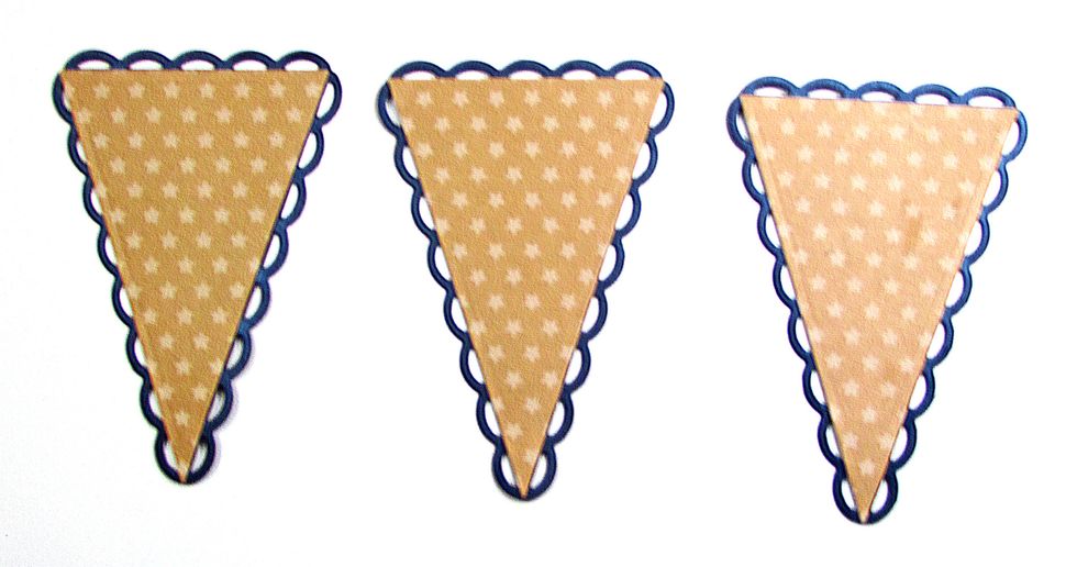 Use double-sided adhesive to attach one star-print pennant to each lacy pennant. Each pennant is approximately 4 1/2" long and 3" wide.