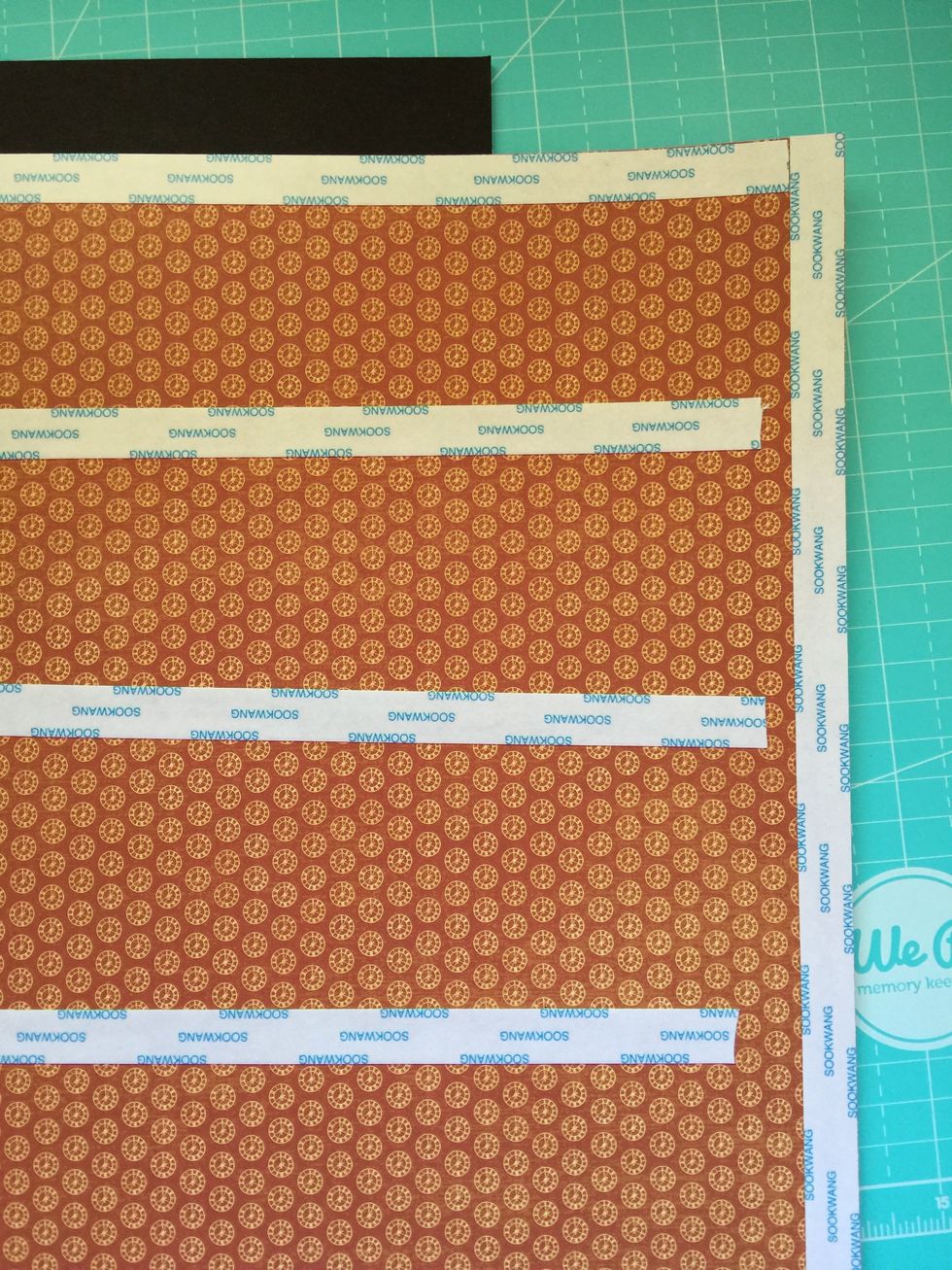 Use double-sided tape on the back side of the paper.