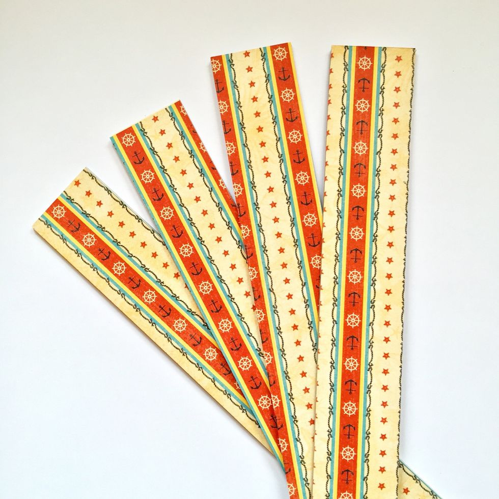 Use double sided tape to cover both sides with decorated paper.