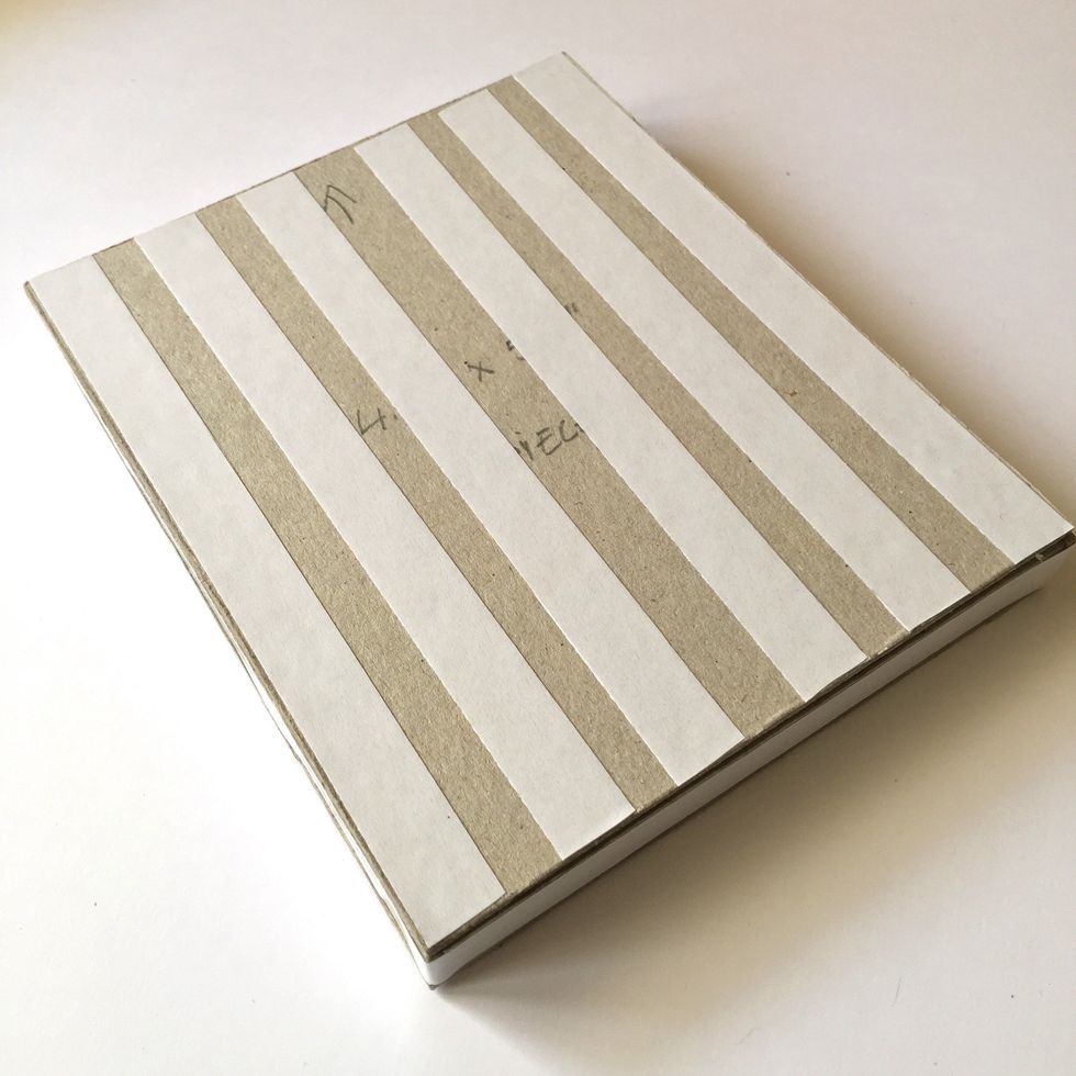 Use double-sided tape to stick the paper.