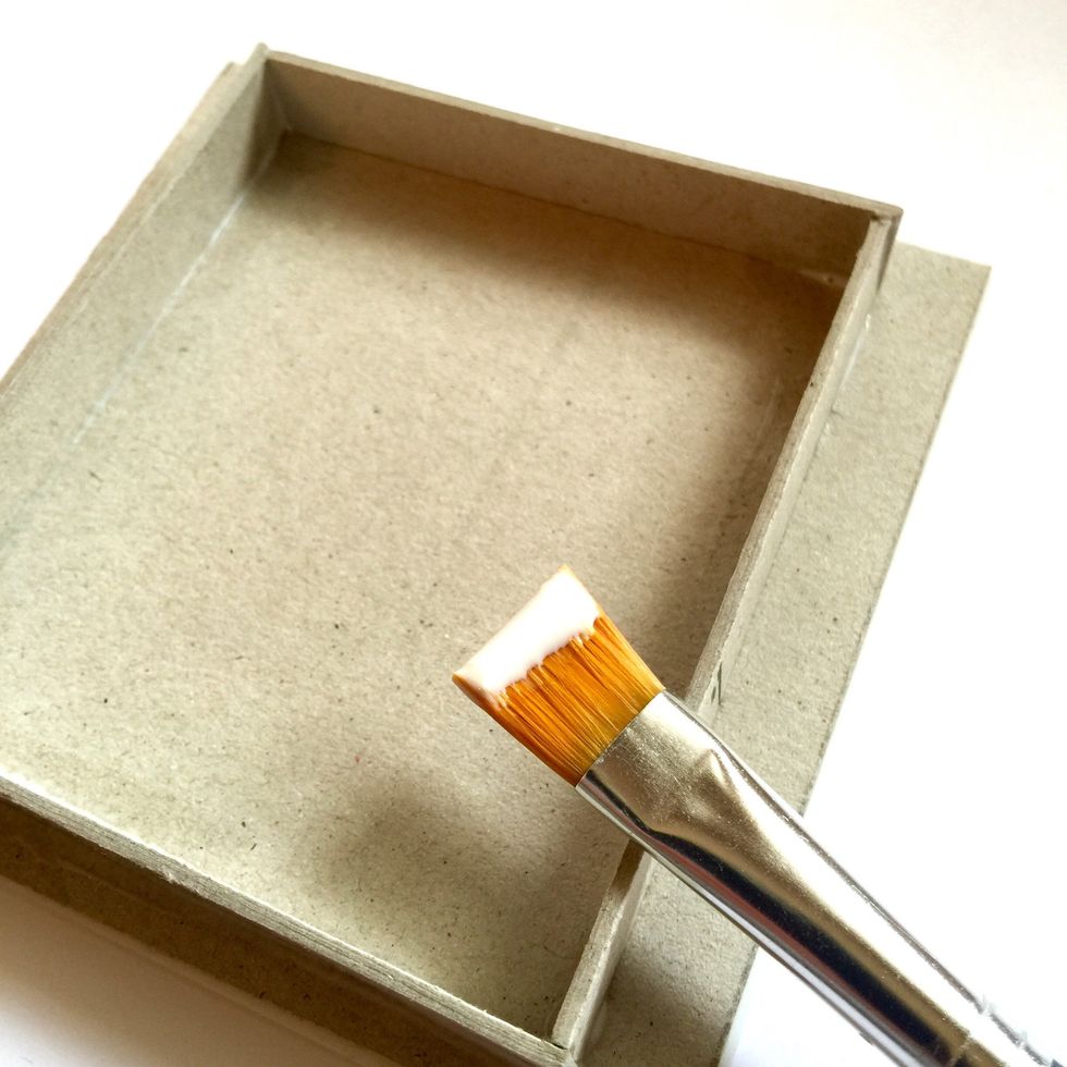 Use double sided tape to stick the photo to the cardboard and strong glue for the four strips. Let them dry.