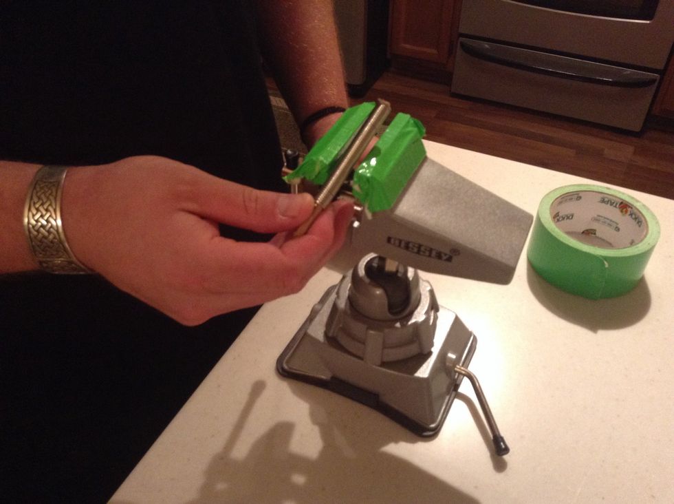 Use duct tape on the vise to prevent scratching the coil. The tape will also grip the coil and prevent it from sliding around while it's being cut.
