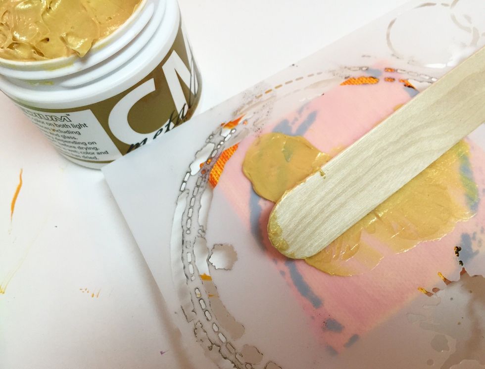 use edge of knife or stick to smooth medium over stencil. return excess medium to jar.