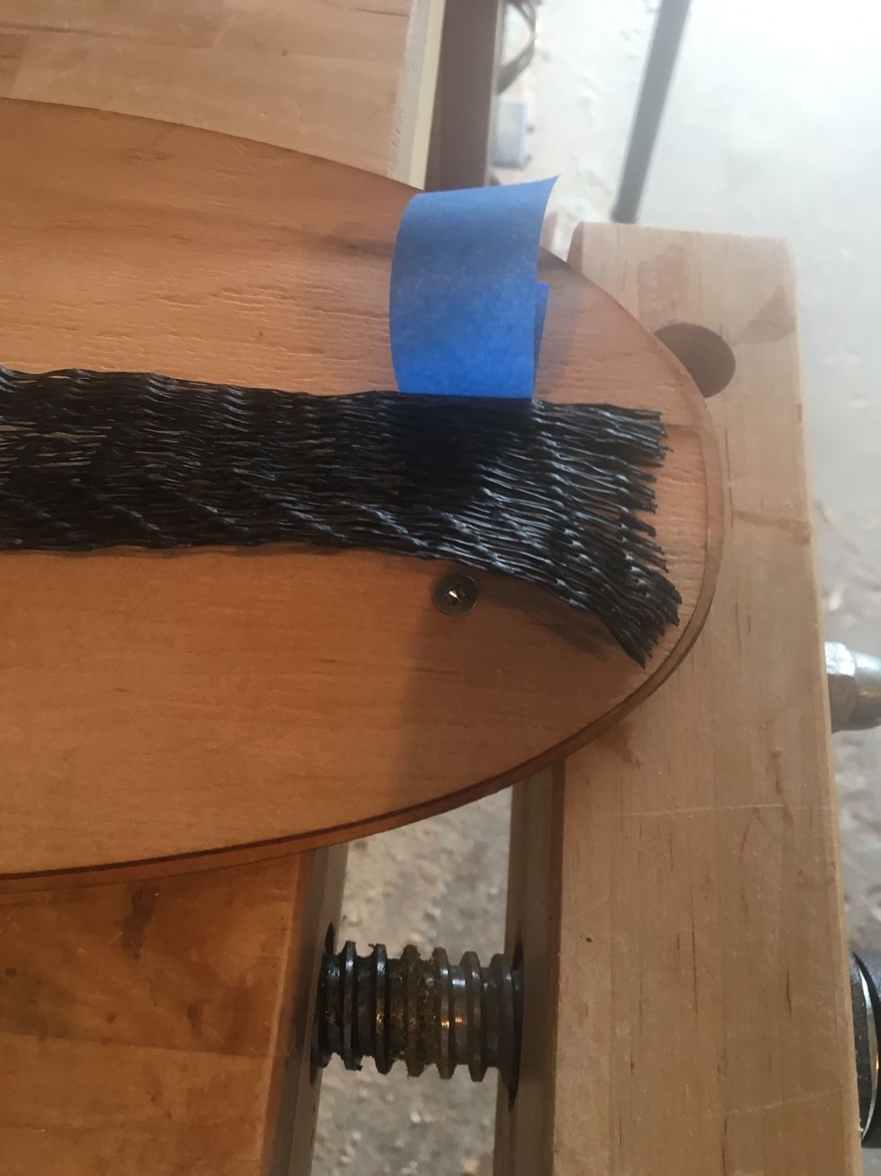 Use Elastics or Painter's Tape to affix Breather Net to the veneers. Position breather net over screw head.