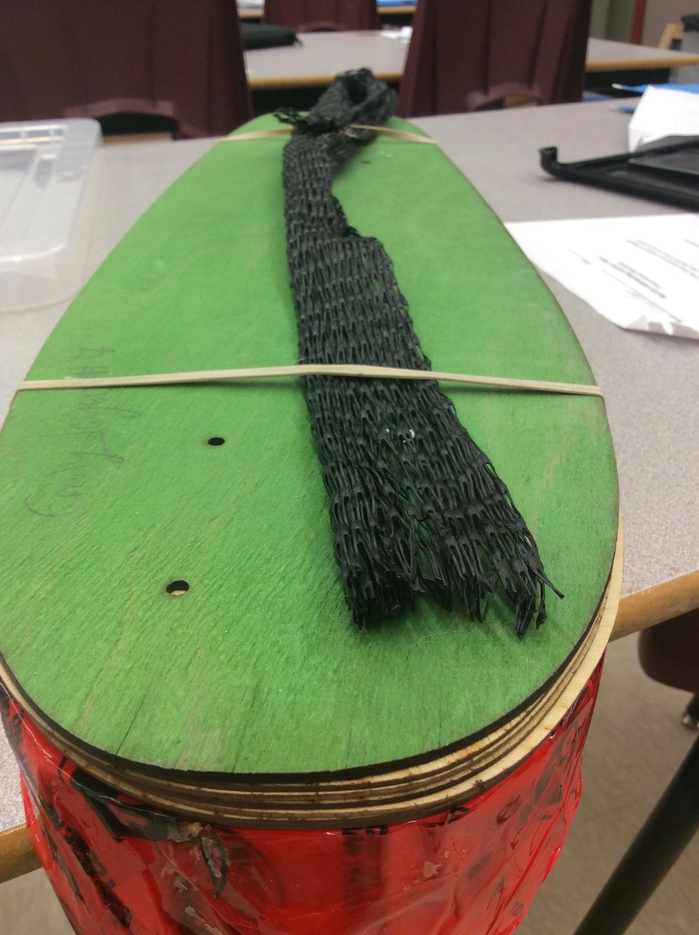 Use Elastics or Painter's Tape to affix Breather Net to the veneers.