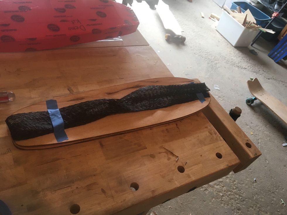 Use Elastics or Painter's Tape to affix Breather Net to the veneers.