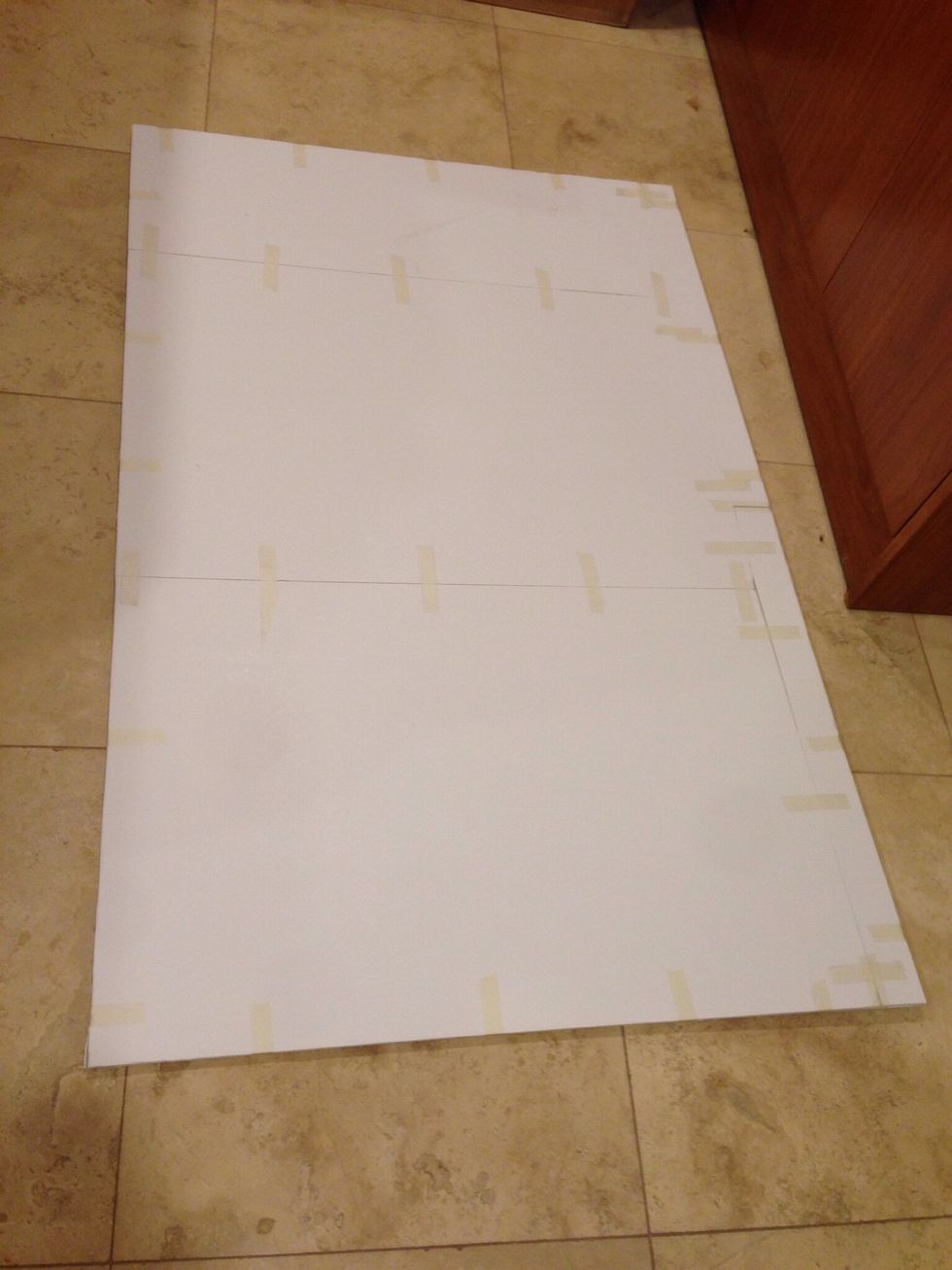 Use Elmer's glue to glue the two boards to each other. Use an exacto knife to trim the edges of the boards to they are uniform.