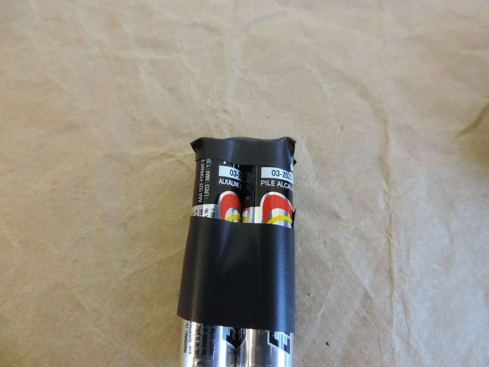 Use enough electrical tape to cover the top and bottom of the batteries. This prevents current from flowing if the batteries come in contact with another battery or metal.