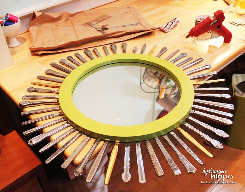 Use epoxy or hot glue to adhere the flat part of the knife to the back of the mirror. I tried E6000 and it did not work so well.