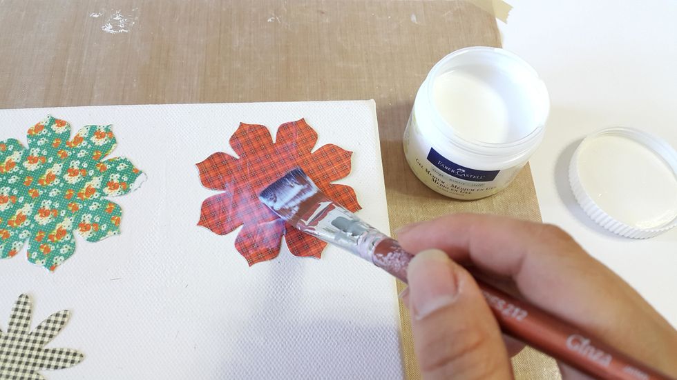 Use Faber-Castell Gel Medium to adhere the flower pieces on the canvas, leave to dry