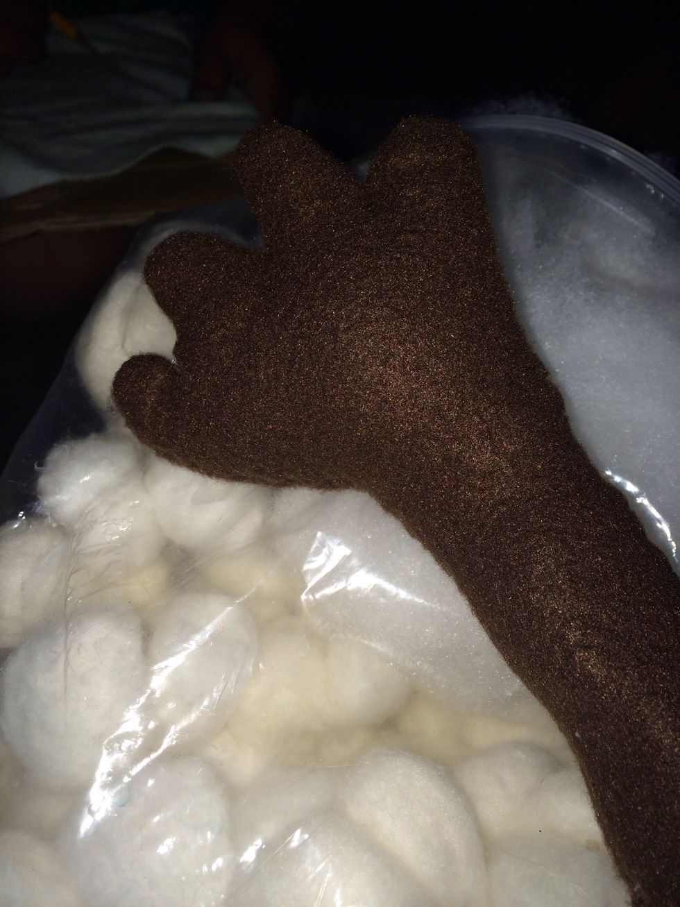 Use fillers or cotton balls to stuff fingers and arms