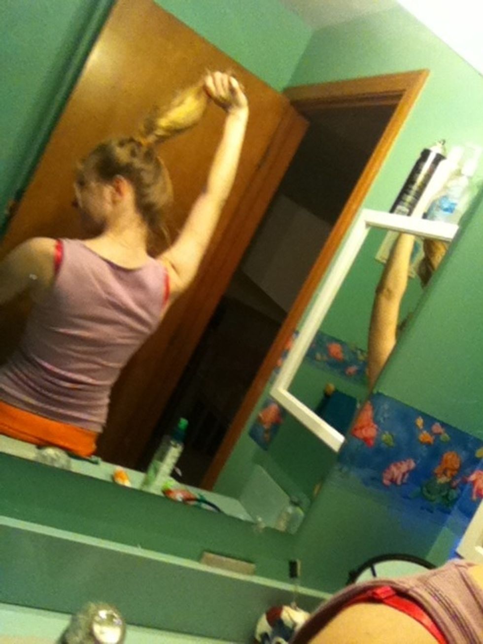 Use first hair tie to make a high pony tail