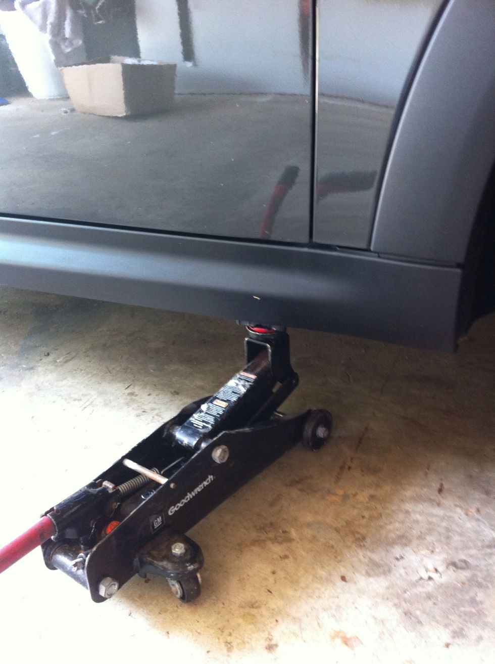 Use floor jack to raise the car.