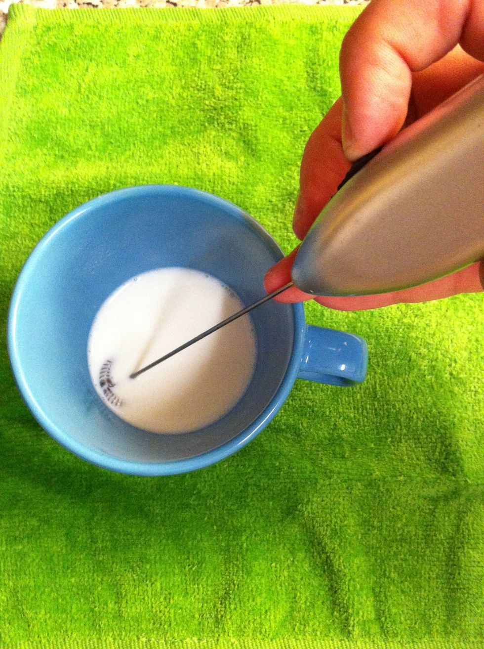 Use frother and hold by having a finger on on/off button and other directly on frother to slow down rotation.