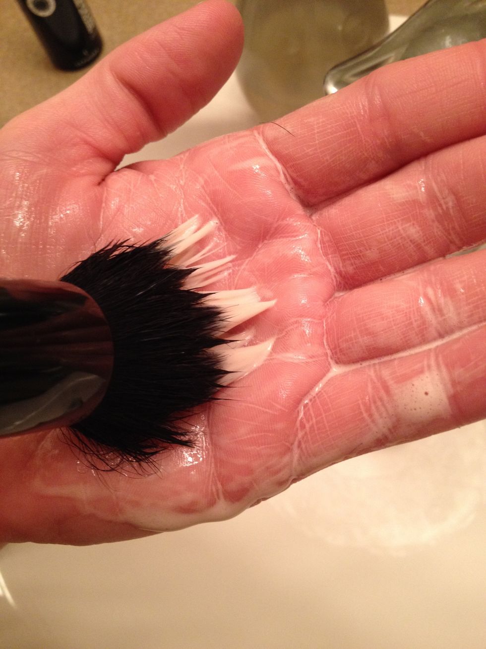 Use gentle circular or swirling motions to create a lather.  You will see the pigment being lifted from the brush and deposited into the lather in your hand.
