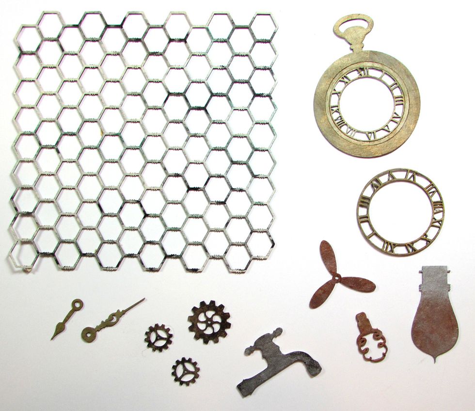 Use gesso and various metallic inks and paints to color the chipboard. Allow to dry.