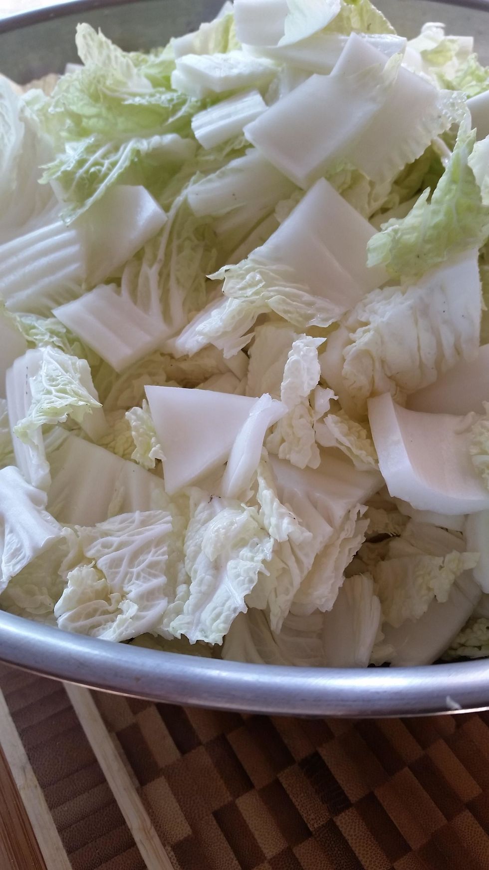 Use gloves to gently combine cabbage, paste and daikon together