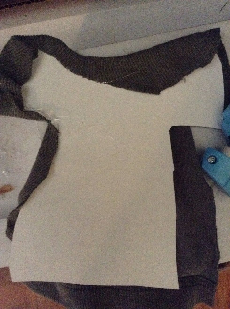 Use glue ( preferably hot glue) to fold down on the back