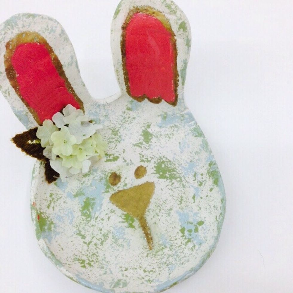 Use glue to attach flowers under one of the ears. Your bunny is ready to use! REMINDER: The bowl is not food or dishwater safe. It will work great for holding small items or a special Easter egg!