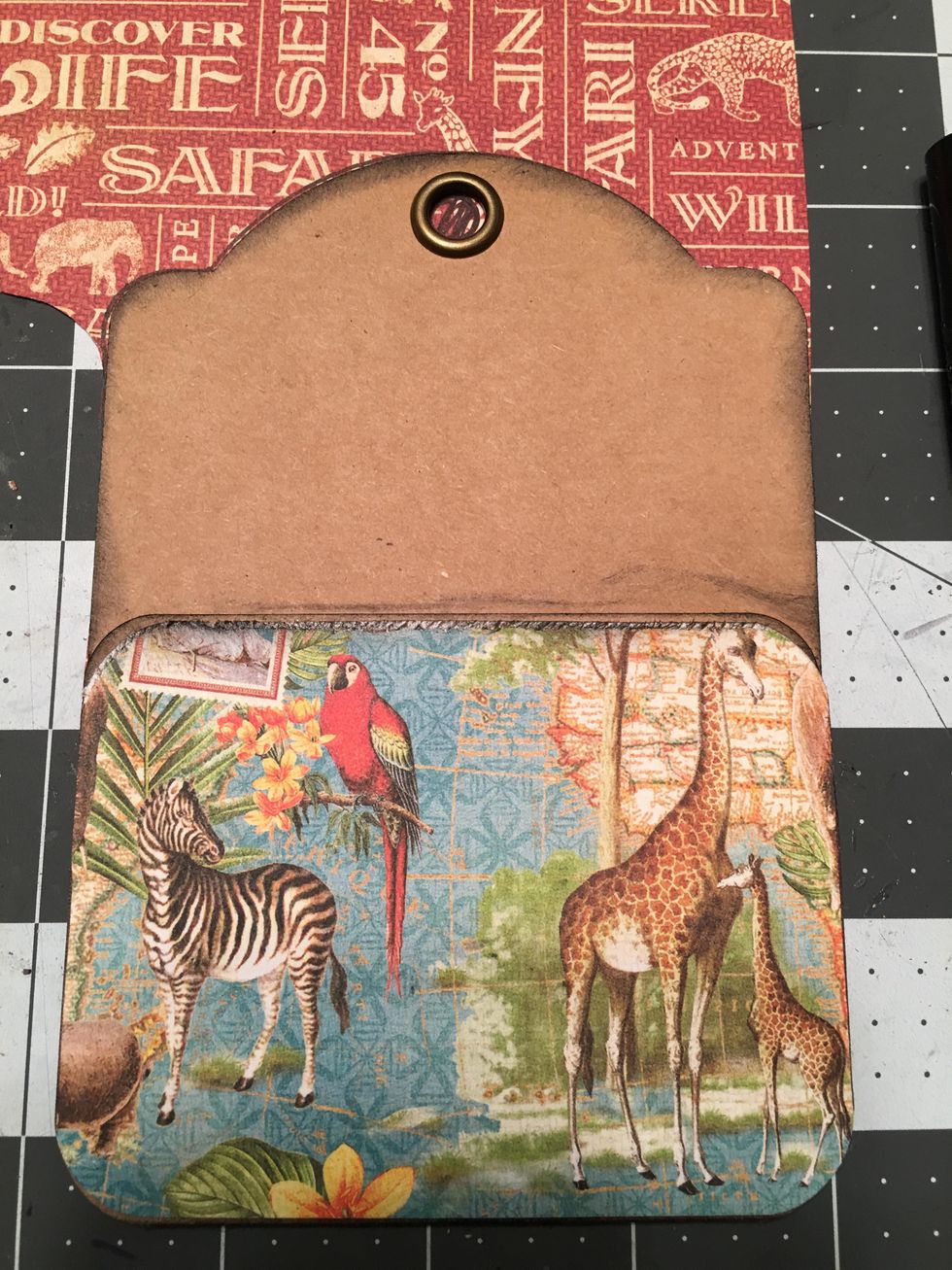 Use glue to attach the paper onto the pocket as shown.