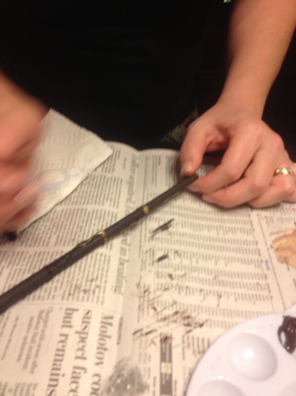 Use gold/silver paint to paint over your glue gun marks