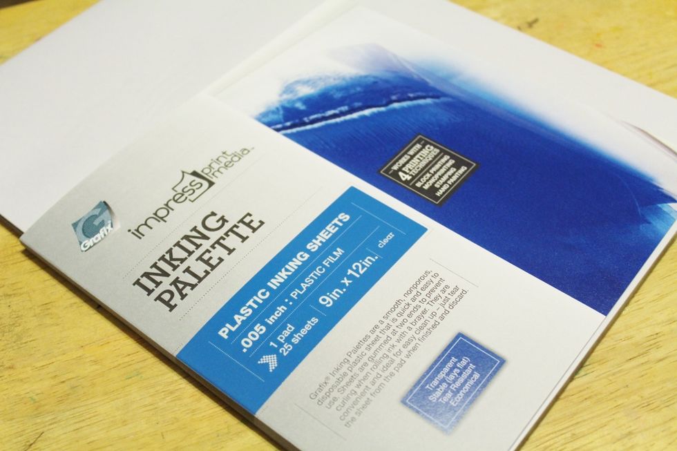 use Grafix Inking Palette to add and blend inks on. the Inking Palette is a pad of 25 sheets that is fused together at both ends. it is stable and lays flat when using a brayer or blending inks...