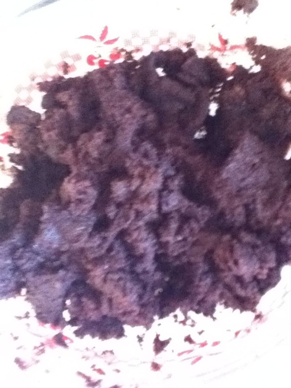 Use half of the container of frosting, and mix it into the cake. It should be squishy,