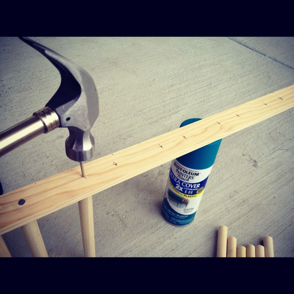Use hammer to nail the rod pieces to the back support. I first drilled hold at the markings to ensure correct placements of the rods and then began hammering