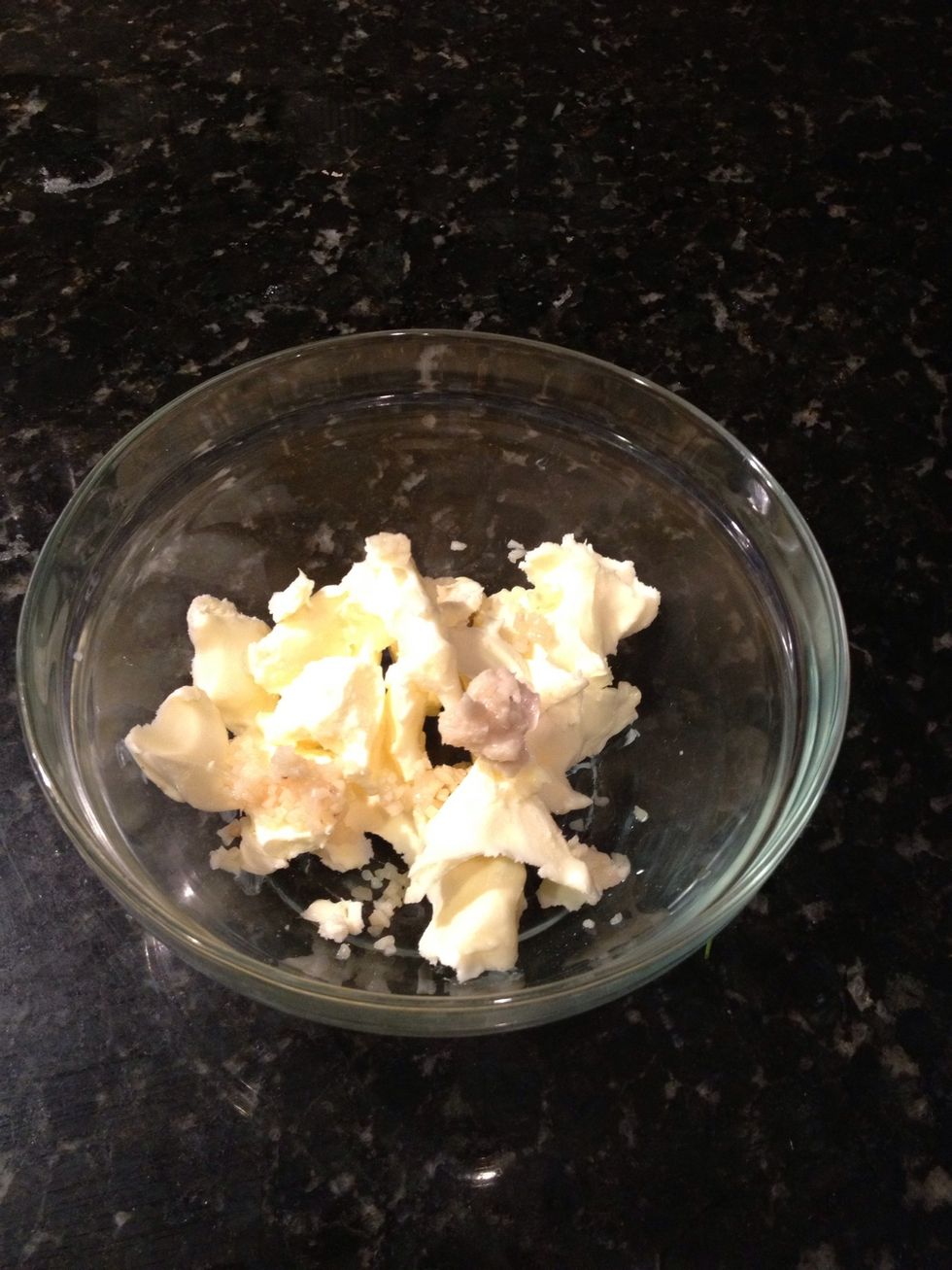 Use hands and massage butter for incorporation of herbs and spices.