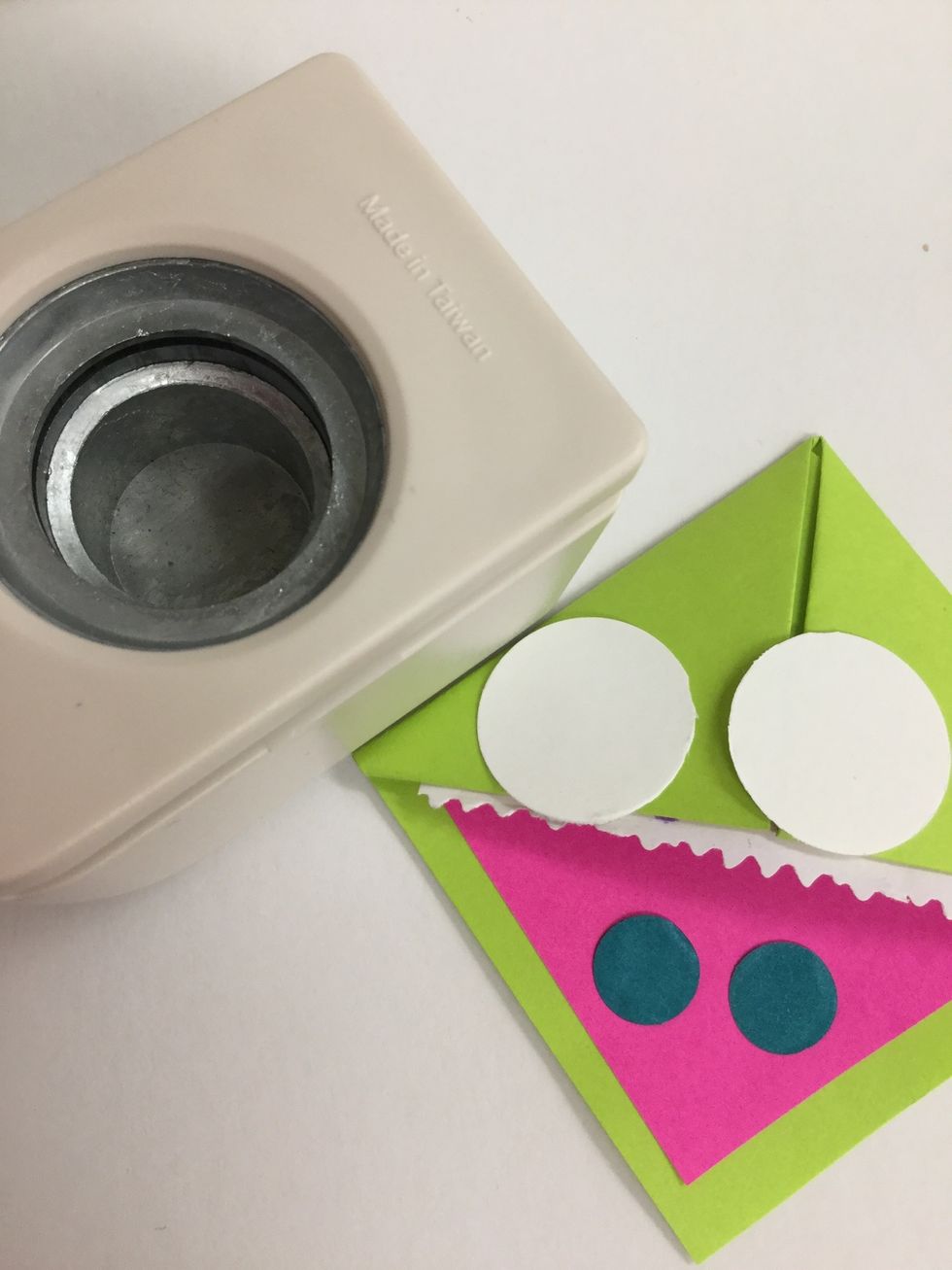 Use hole punches to cut circles for the eyes.