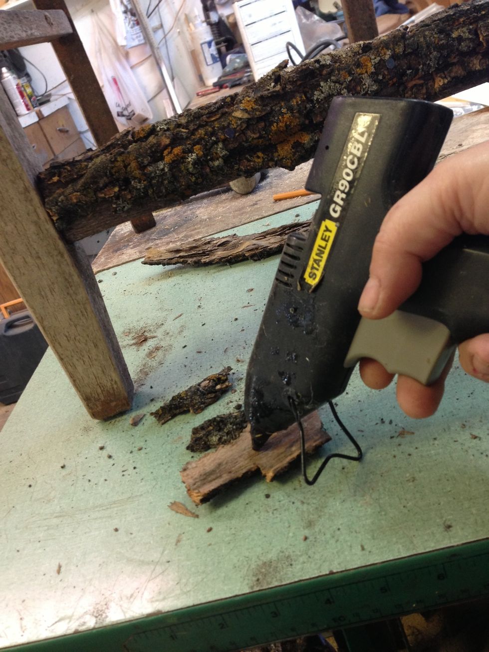 Use hot glue liberally on the bark pieces