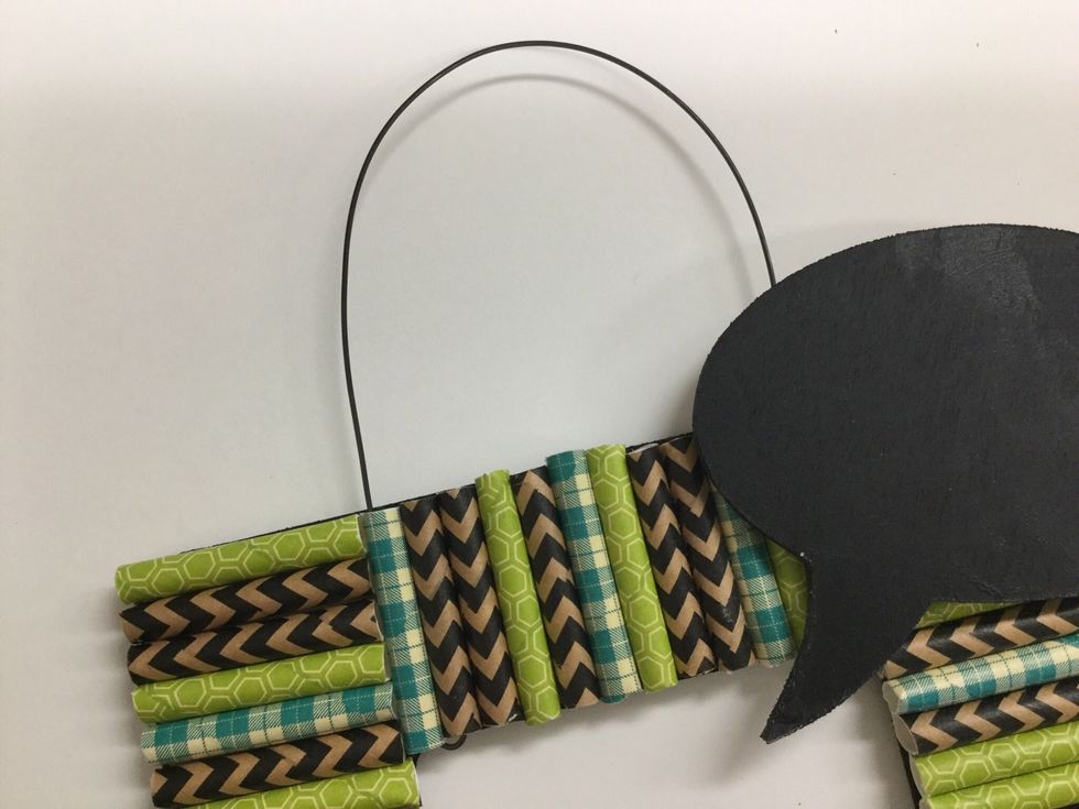 Use hot glue or glue dots to adhere the quote bubble in place.