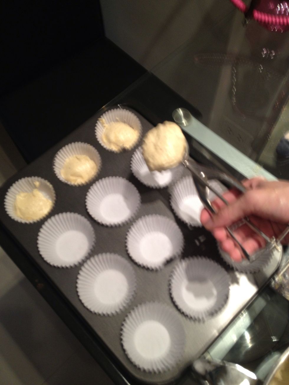 Use ice cream scoop to fill em up. This should make perfect 12 muffins. Give the pan a few tap, so there wont be any air pocket under the muffins.