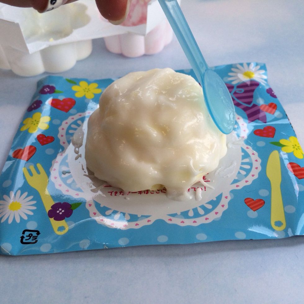 Use Included Spoon/Spatula to Spread Vanilla Frosting over both Layers of Cake