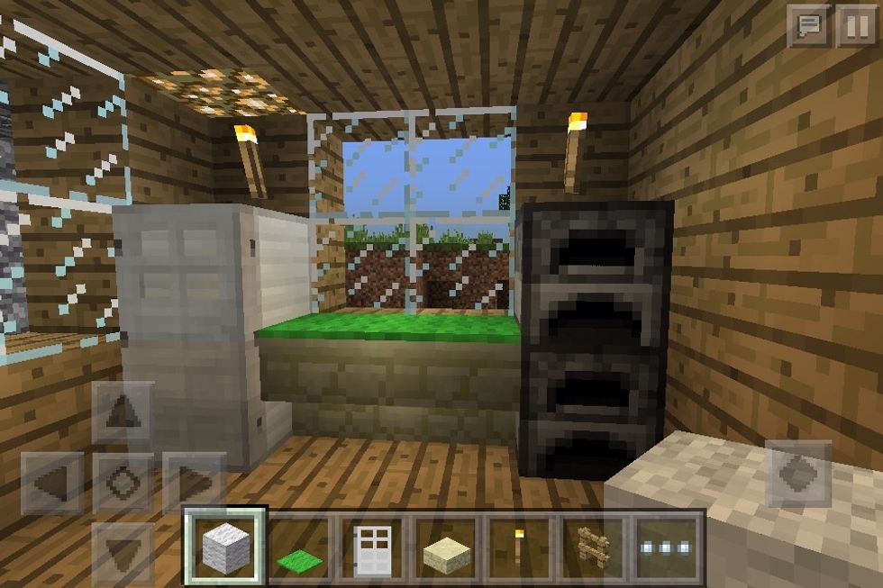 Use iron blocks, doors, stairs and furnaces for a kitchen
