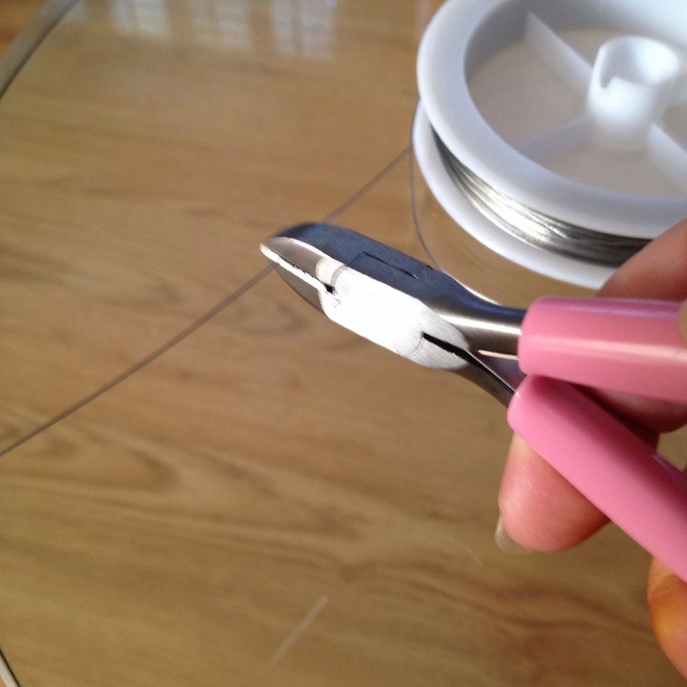 Use jewellery cutter to cut a length off wire longer than what you actual need