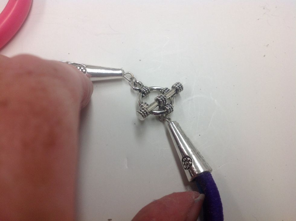 Use jump rings to fasten toggle ends to bead cones.