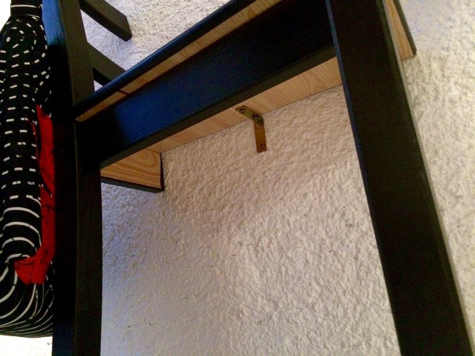 Use L-brackets to mount the chairs and the table on the wall.