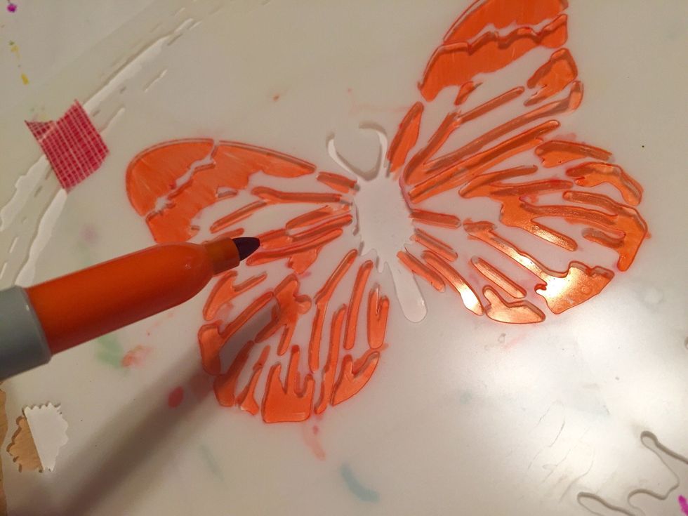 use large butterfly on Butterfly Collage stencil and Orange Sharpie to add wing portion of design to Shrink Film (should have space on sheet used for top).