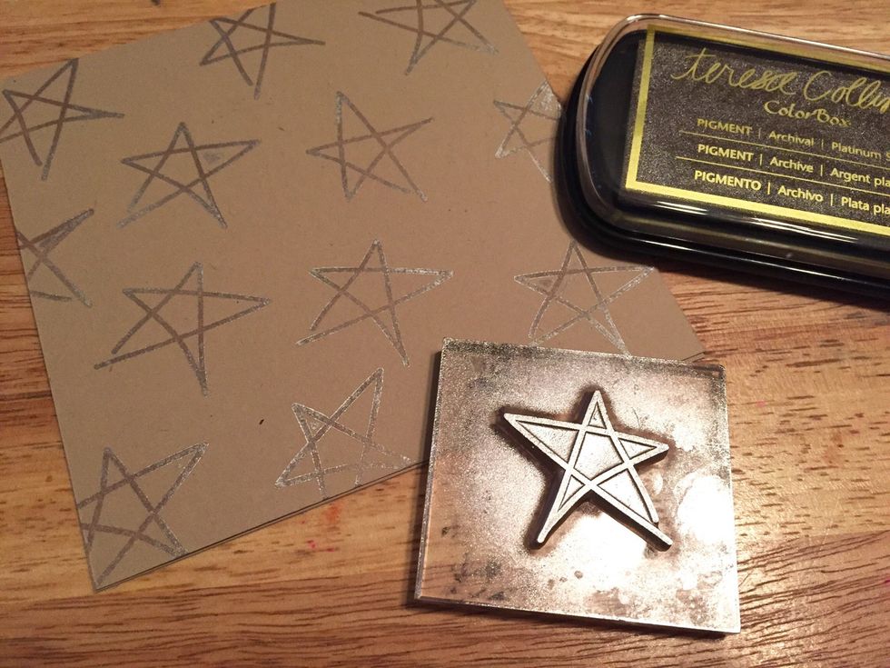 use large scribble star stamp with Platinum Silver Ink to add stars all over card front.