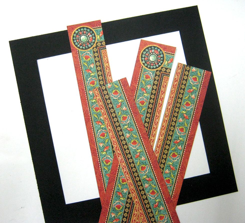 Use last frame for front layer. Cut the frame from Enchanted Forest paper to four strips. Cut out the circles.
