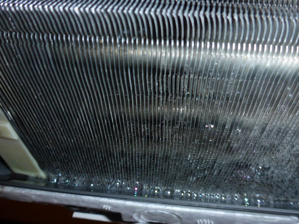 Use lots of water, but avoid flooding the drip-pan. Let it drain before rinsing more.