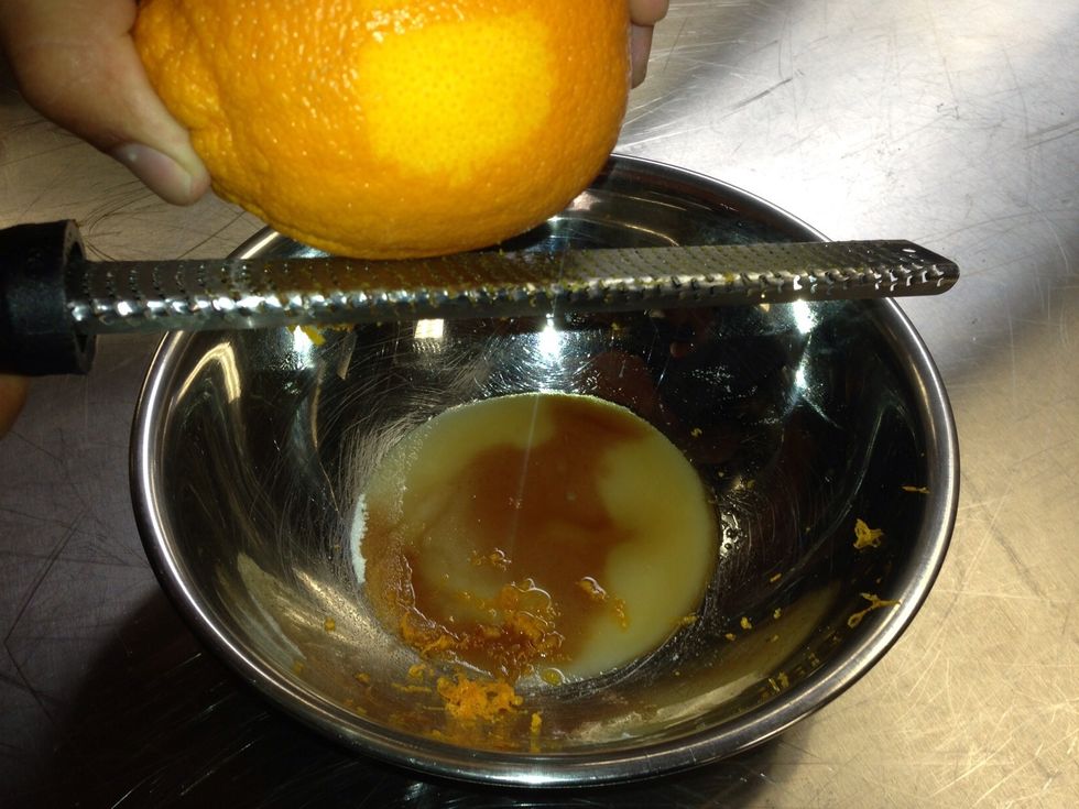Use microplane to add zest of two oranges