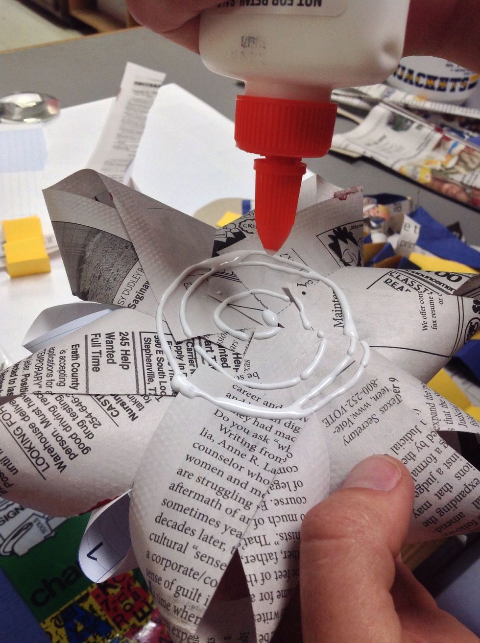 Use more glue to adhere flower to streamers.