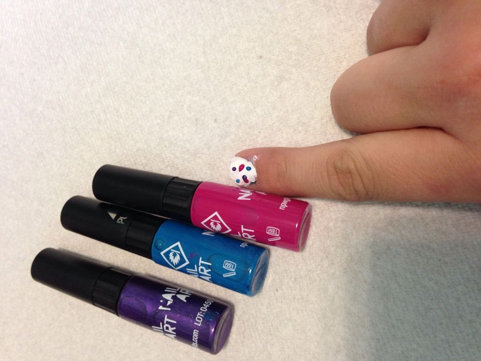 Use nail pens or tooth picks to dot your nails.