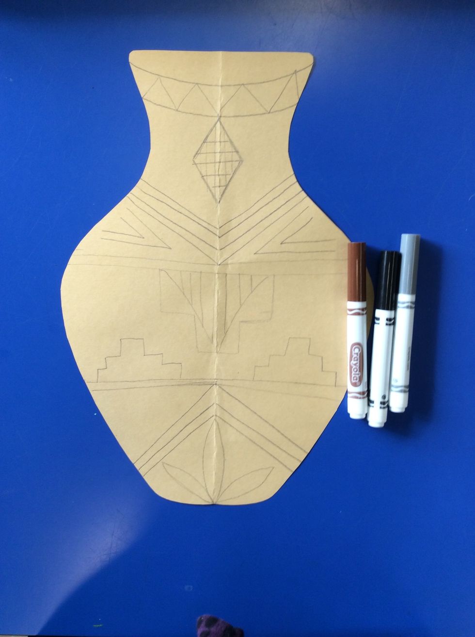 Use neutral colors (black, brown, grey, white) to color in your pot. You can use marker, oil pastel or crayon.