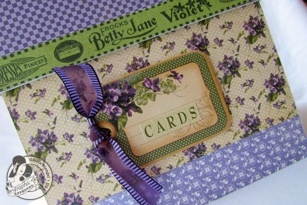 Use one of the Place in Time Chipboard elements and the Secret Garden Cardstock Stickers to create a label for the front of your box.